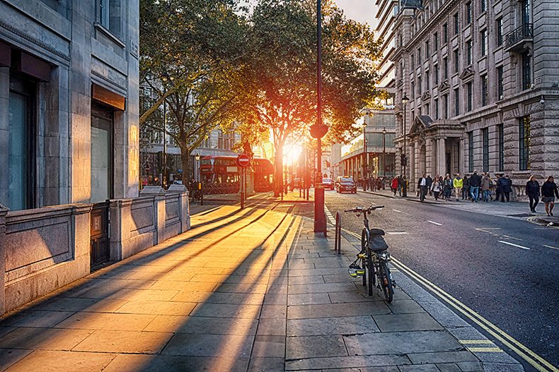 sun streaming through London street with parked bike